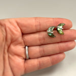 Sterling Silver Crescent Moon Labradorite Stud Earrings in hand ear for scale