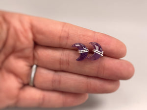 Crescent Moon Amethyst Stud Earrings in Sterling Silver in hand for scale