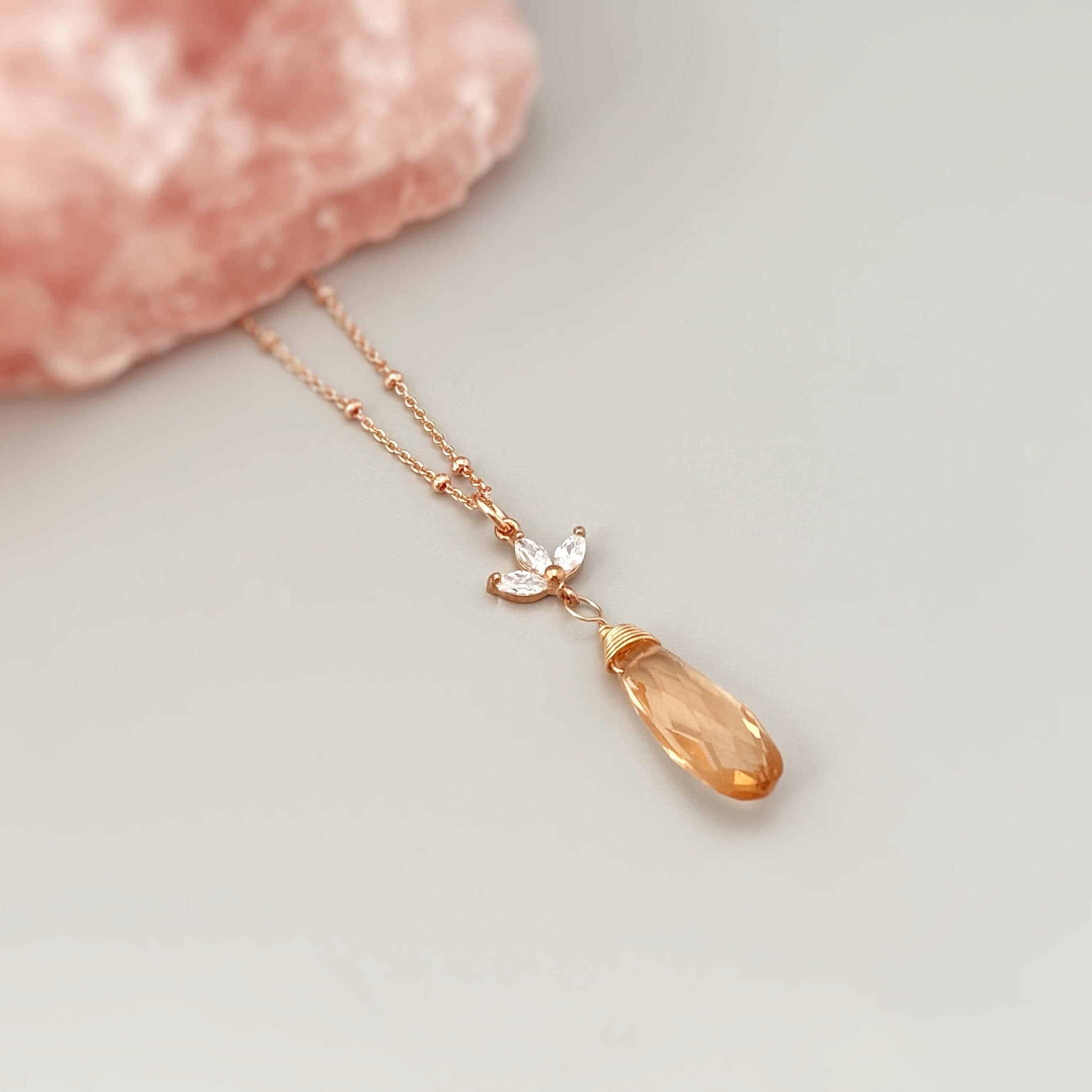 Morganite Crystal Necklace with a rose quartz display