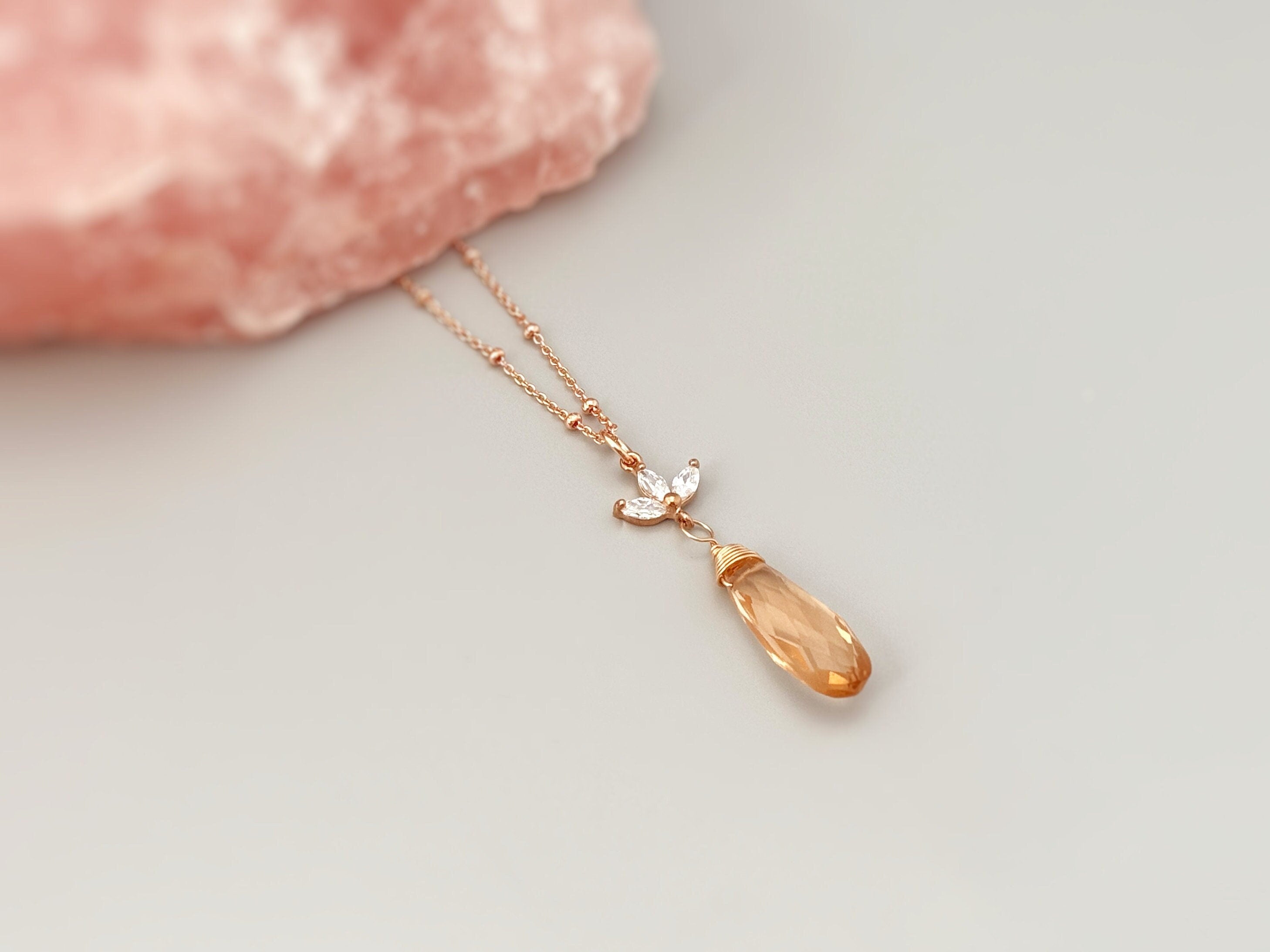 Morganite Crystal Necklace with a rose quartz display