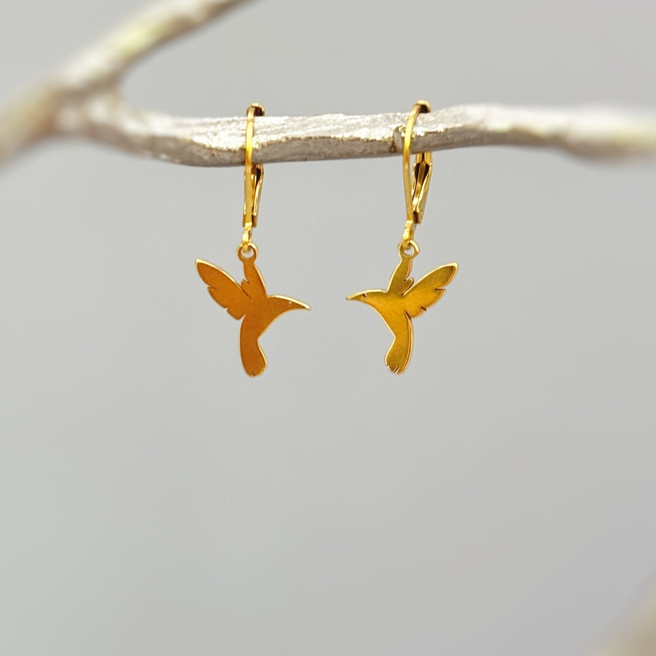 Handmade Hummingbird earrings dangle in gold or silver. These bird earrings are the perfect gift for moms, nature and bird lovers.