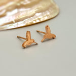 Tiny Hummingbird Earrings in rose gold, gold, and silver. Dainty second hold or cartilage earrings make a great gift for bird lovers, granddaughters, teenagers, and children.