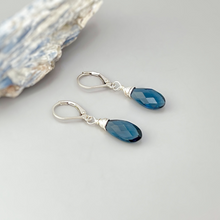 Load image into Gallery viewer, a pair of blue glass earrings sitting on top of a table