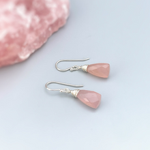 Load image into Gallery viewer, a pair of pink earrings sitting on top of a pink rock