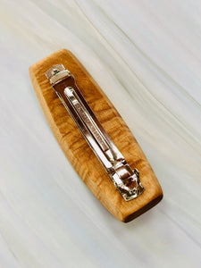 I hand sculpt this lovely barrette from beautiful premium  Great Lakes Birdseye Maple. I then inlay 3 beautiful cognac-colored genuine amber cabochons in hand-made sterling silver settings.  The amber cabochons have wonderful inclusions and are beautiful when the light passes through them! 
