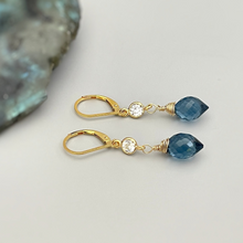 Load image into Gallery viewer, a pair of gold - plated earrings with blue crystal drops