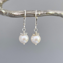 Load image into Gallery viewer, a pair of white pearls hanging from a branch